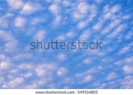 Pure white clouds like cotton wool with blue sky in evening