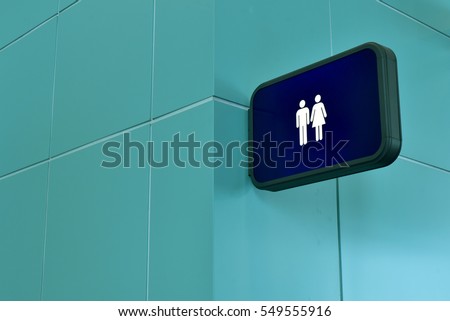 Public restroom signs with a disabled access symbol,