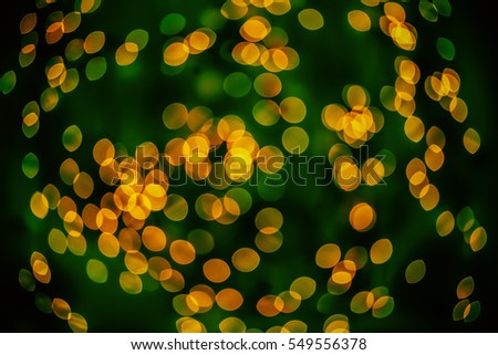 Bokeh background glowing oval shaped glow dark yellow green mixed empty