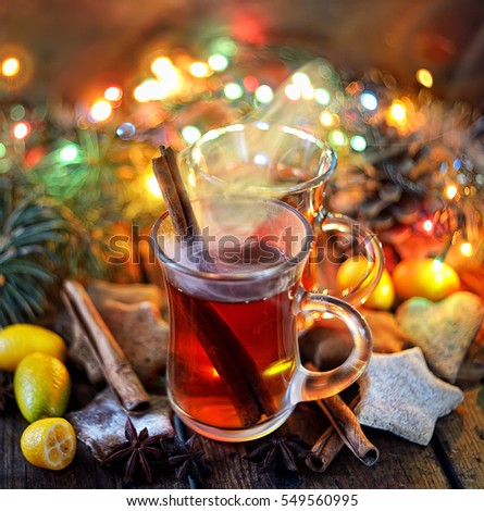 tea with cinnamon, pine needles, star anise and cookies Royalty-Free Stock Photo #549560995