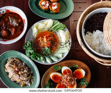 Thai Cuisine,Sweet and sour eggs,(Fried Egg with Tamarind Sauce) Spicy tuna Curry Streamed Seafood in Coconut Cup Beef massaman curry, thai cuisine
