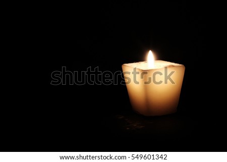 Candle isolated on black