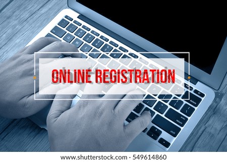 Hand Typing on keyboard with text ONLINE REGISTRATION