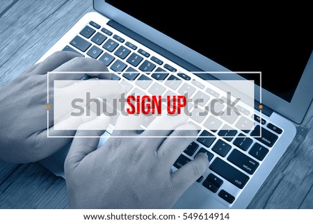 Hand Typing on keyboard with text SIGN UP