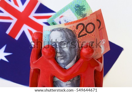 Australian dollar notes in a huddle with the Australian flag.