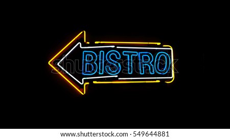 Bistro neon sign in night and black background.