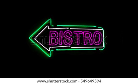Bistro neon sign in night and black background.