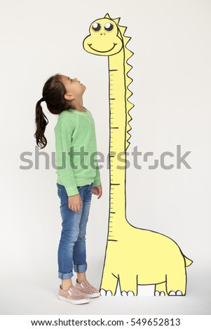 Kid looking up at a tall paper dinosaur