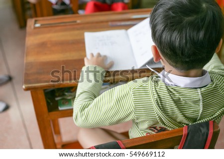 kids and teacher in the classroom for background usage.
