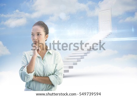 Portrait of a smiling businesswoman against steps leading to closed door in the sky