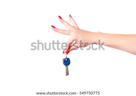 house keys in the hand of a young woman