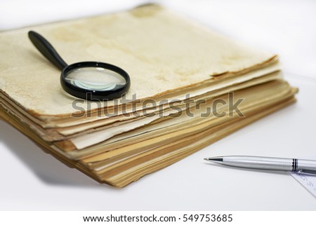 Old books with pen. Isolated documents on white background. Royalty-Free Stock Photo #549753685