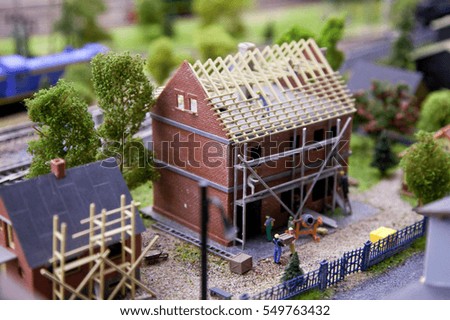A scale model of the urban landscape. The construction of low-rise houses. The construction of the roof.