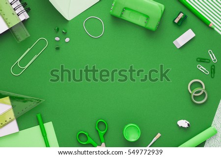 Colorful composition of school supplies: crayons, scissors, markers, globe, rulers, paints. Copy space in the center. Vibrant color background. Flat lay. Back to school. 