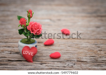 Heart shape and rose on wooden background with space to write. Valentine concept, Vintage tone, AF point selection.
