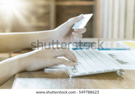 Shopping online concept. Business woman using computer with a credit card to shopping online.