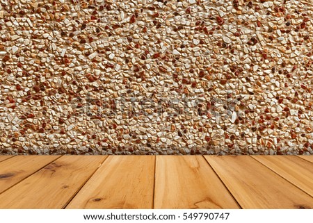 A wooden table and red spot sand rock background