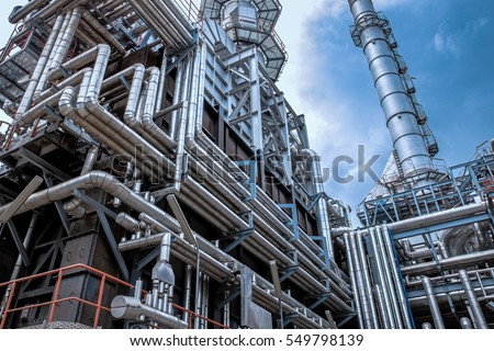 Close up Industrial view at oil refinery plant form industry zone with sunrise and cloudy sky Royalty-Free Stock Photo #549798139