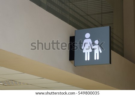 sign of mother and child in the interior of the station