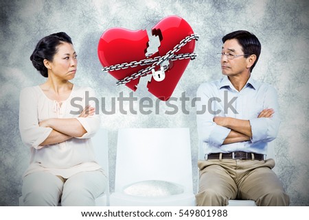 Older asian couple having an argument against locked heart