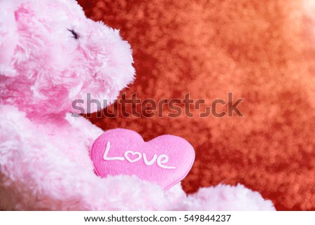 teddy Bear with Heart on red background,concept valentine