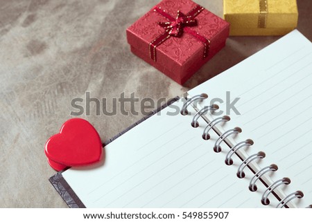 Valentines day background. Valentine hearts with open blank notebook on dark wooden background. Writing romantic letters.