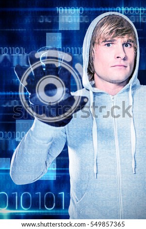 Man with black gloves staring at camera against blue technology design with binary code