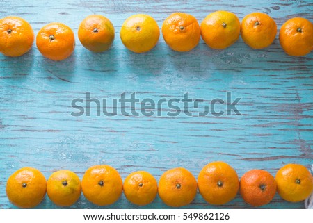 Tangerines on a blue background.