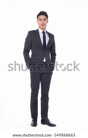 Full body young businessman standing on white background Royalty-Free Stock Photo #549868663