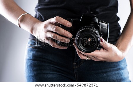 Camera in hand Photographer