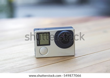action camera on wooden table