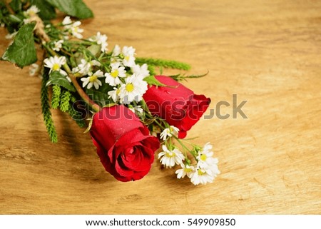 Red roses on the old wooden floor. Special for fans love on Valentine's Day and postcards.