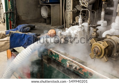 Worker is loading liquid argon to storage tank