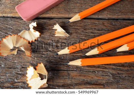 A top view image of several sharpened pencils.