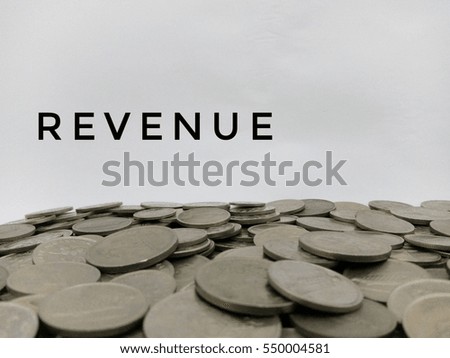 Flat lay design concept - Word Revenue with Malaysia coins isolated on the white background  