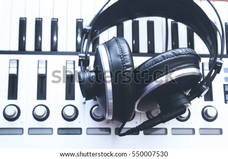 Headphones and MIDI keyboard, closeup