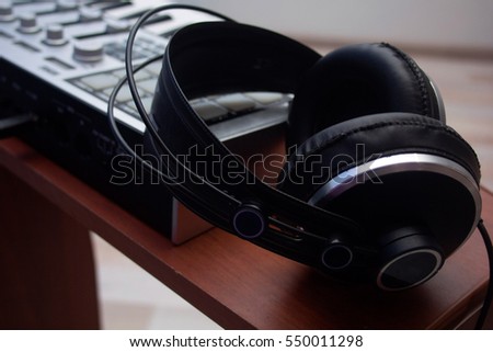 Headphones and MIDI keyboard, closeup