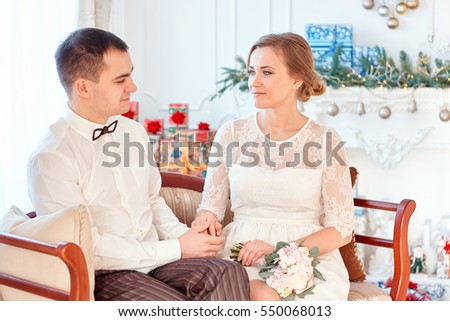 first date; wedding photo studio; Suite conversation. Look Suite. Black groom and beautiful bride blond girl with beautiful eyes and teeth.