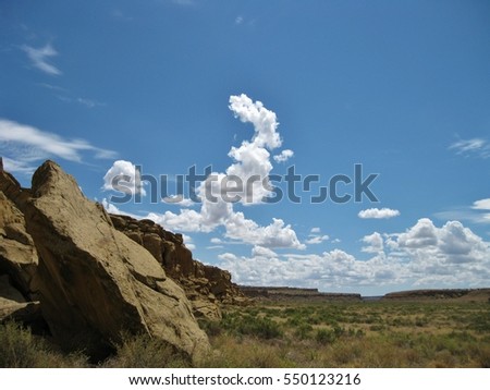 Chaco Canyon landscape with bright, cloud-filled summer sky