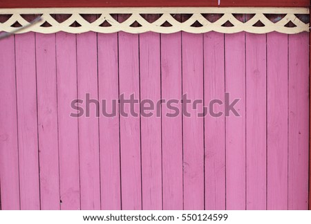 Closeup picture of wooden pink fence