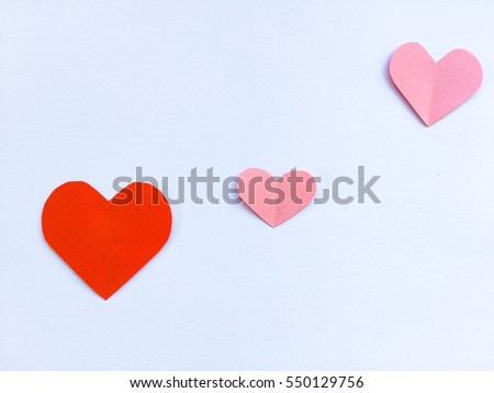 Red Pink paper hearts  {Paper Heart stacked} Isolated on a white background. You can use for greeting card "Happy Valentine's Day"