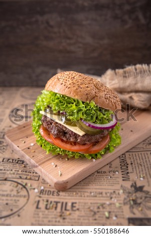 Delicious fresh burgers with beef, tomato, cheese, pickles, onions and lettuce. Free space for text