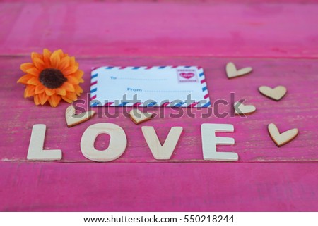 Hearts and envelope with wooden table background. Valentines day idea, concept. love backdrop