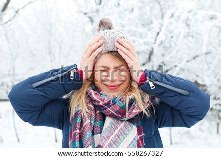 Picture of a young woman having a headache