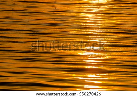 ?blur focus picture of the water surface in the sunrise time