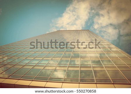 architecture with window building pattern with the reflection of sky for background .