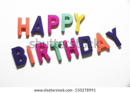 Colorful letter spelling Happy Birthday on white background.