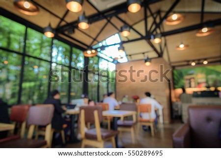 Blurred image coffee shop with abstract bokeh light background. Vintage tone