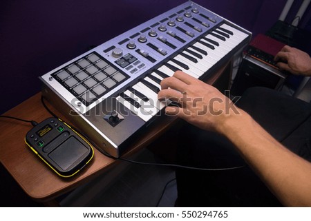 Man is using MIDI keyboard