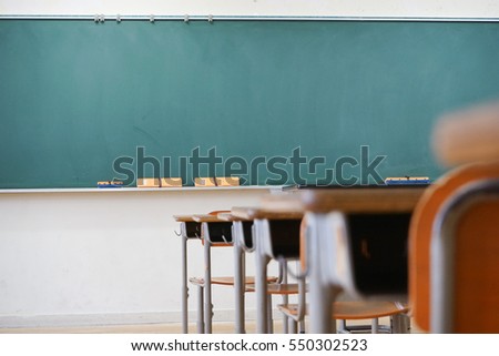 School classroom with blackboard Royalty-Free Stock Photo #550302523